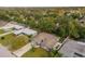 An aerial view of the house with a tree-filled neighborhood at 1407 Dunsany Ave, Orlando, FL 32806