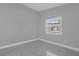 Bright bedroom features tiled flooring and a window that provides natural light at 1407 Dunsany Ave, Orlando, FL 32806