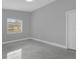 Bright bedroom features tiled flooring and a window that provides natural light at 1407 Dunsany Ave, Orlando, FL 32806