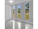 Bright bedroom with three large windows and tiled floor at 1407 Dunsany Ave, Orlando, FL 32806