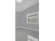 Bright bedroom features tiled flooring and a window that provides natural light at 1407 Dunsany Ave, Orlando, FL 32806