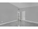 Spacious bedroom with en-suite bathroom features tile floor and bright interior paint at 1407 Dunsany Ave, Orlando, FL 32806