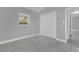 Cozy bedroom features window, closet, and tiled flooring at 1407 Dunsany Ave, Orlando, FL 32806