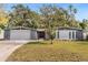 Charming single-story home with a well-manicured front lawn and welcoming curb appeal at 1407 Dunsany Ave, Orlando, FL 32806