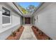 Inviting front entryway with a landscaped walkway leading to the beautiful, double front doors at 1407 Dunsany Ave, Orlando, FL 32806