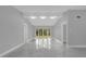 Spacious living room with great natural light, smooth tile floors and neutral wall colors at 1407 Dunsany Ave, Orlando, FL 32806