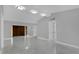 Open living space featuring recessed lighting, tile flooring, and a warm, neutral color palette at 1407 Dunsany Ave, Orlando, FL 32806