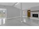 Comfortable living area featuring a fireplace, neutral paint, and smooth tile flooring at 1407 Dunsany Ave, Orlando, FL 32806