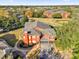 Aerial view of the exterior showcasing the roof and surrounding area with trees at 142 Villa Di Este Ter # 204, Lake Mary, FL 32746