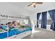 Bright bedroom with bunkbeds, carpeting, two windows, and ample natural light at 142 Villa Di Este Ter # 204, Lake Mary, FL 32746