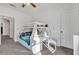Bright bedroom featuring a bunk bed with a built-in desk and storage shelves at 142 Villa Di Este Ter # 204, Lake Mary, FL 32746