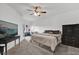 Bedroom featuring neutral carpet, ceiling fan, and a sliding glass door leading to balcony at 142 Villa Di Este Ter # 204, Lake Mary, FL 32746