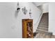 Entryway featuring stairs, a small shoe rack, and decorated white walls at 142 Villa Di Este Ter # 204, Lake Mary, FL 32746