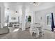 Open floor plan with a view of the living room and dining area with white furniture at 142 Villa Di Este Ter # 204, Lake Mary, FL 32746