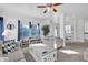 Bright living room with neutral furniture, a ceiling fan, and plenty of sunlight at 142 Villa Di Este Ter # 204, Lake Mary, FL 32746