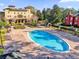 Aerial view of the pool and deck at the community clubhouse with lounge chairs at 142 Villa Di Este Ter # 204, Lake Mary, FL 32746