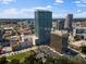 A stunning aerial view captures the cityscape, showcasing various buildings, parks, and urban infrastructure at 150 E Robinson St # 1214, Orlando, FL 32801