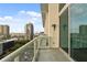 This apartment balcony offers refreshing city views for quiet relaxation at 150 E Robinson St # 1214, Orlando, FL 32801