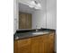 Modern bathroom with a granite countertop vanity and a stylish backsplash at 150 E Robinson St # 1214, Orlando, FL 32801