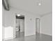 Well-lit laundry room with a washing machine and wire rack shelving at 150 E Robinson St # 1214, Orlando, FL 32801