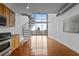 Loft living room with a spiral staircase and floor-to-ceiling windows offering city views and lots of light at 150 E Robinson St # 1214, Orlando, FL 32801