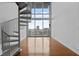 Bright and airy living room with a spiral staircase and large windows with a city view at 150 E Robinson St # 1214, Orlando, FL 32801