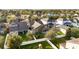 Aerial view showcasing the back of the property, a well maintained lawn, fencing and play structure at 15174 Evergreen Oak, Winter Garden, FL 34787