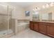 Bright bathroom featuring a glass-enclosed shower, separate tub, double sink vanity with granite counters, and tile flooring at 15174 Evergreen Oak, Winter Garden, FL 34787