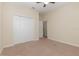 Bedroom view featuring neutral walls and carpet with a closet and entry into another room at 15174 Evergreen Oak, Winter Garden, FL 34787