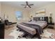 Well decorated bedroom with a unique cowhide rug and gold accented furniture at 15174 Evergreen Oak, Winter Garden, FL 34787