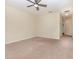 Spacious bedroom featuring neutral carpet, a ceiling fan, and ample natural light, ideal for relaxation and comfort at 15174 Evergreen Oak, Winter Garden, FL 34787