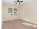 Bright bedroom with neutral walls, plush carpeting, and natural light from the window at 15174 Evergreen Oak, Winter Garden, FL 34787