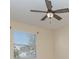 Bedroom featuring tan carpet and neutral walls with a ceiling fan and a bright window at 15174 Evergreen Oak, Winter Garden, FL 34787