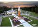 Beautiful clock tower with well manicured landscaping featuring annual flowers in bloom at 15174 Evergreen Oak, Winter Garden, FL 34787