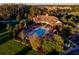 An aerial view of a community pool area, with ample seating and lush landscaping at 15174 Evergreen Oak, Winter Garden, FL 34787