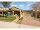 Inviting single-Gathering home featuring a well-manicured lawn, and a cozy front porch at 15174 Evergreen Oak, Winter Garden, FL 34787