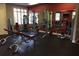 Well-equipped fitness center with modern weight machines and workout benches at 15174 Evergreen Oak, Winter Garden, FL 34787