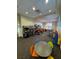 Fun game room with arcade games, a table and chairs, and colorful decor for entertainment at 15174 Evergreen Oak, Winter Garden, FL 34787
