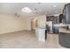 Open kitchen features granite counters, stainless appliances and breakfast bar seating at 15174 Evergreen Oak, Winter Garden, FL 34787
