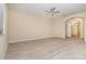 Spacious and bright living room with wood-style flooring and neutral walls at 15174 Evergreen Oak, Winter Garden, FL 34787