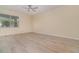 Bright, airy living room features a large window and modern flooring at 15174 Evergreen Oak, Winter Garden, FL 34787