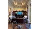 Spacious living room with a comfortable sofa, built-in entertainment center, and coffered ceiling detail at 15174 Evergreen Oak, Winter Garden, FL 34787