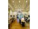 A large room serves as a gathering space with tables and comfortable seating at 15174 Evergreen Oak, Winter Garden, FL 34787