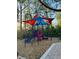 Outdoor playground with colorful play structures and a soft ground surface for safety at 15174 Evergreen Oak, Winter Garden, FL 34787