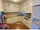 Efficient kitchen with ample cabinet space and essential appliances at 1522 S Shore Dr, Tavares, FL 32778