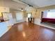 A living room with open floor plan and a bedroom view at 1522 S Shore Dr, Tavares, FL 32778