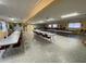Expansive meeting room with multiple tables and chairs, perfect for gatherings at 1522 S Shore Dr, Tavares, FL 32778