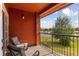 Relaxing balcony with chairs and view of the lake at 167 Villa Di Este Ter Ter # 213, Lake Mary, FL 32746