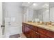 Bathroom features a double granite vanity, framed mirrors, and a shower and tub combination at 167 Villa Di Este Ter Ter # 213, Lake Mary, FL 32746