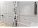 Clean and functional bathroom features a shower and tub combination with tiled walls at 167 Villa Di Este Ter Ter # 213, Lake Mary, FL 32746